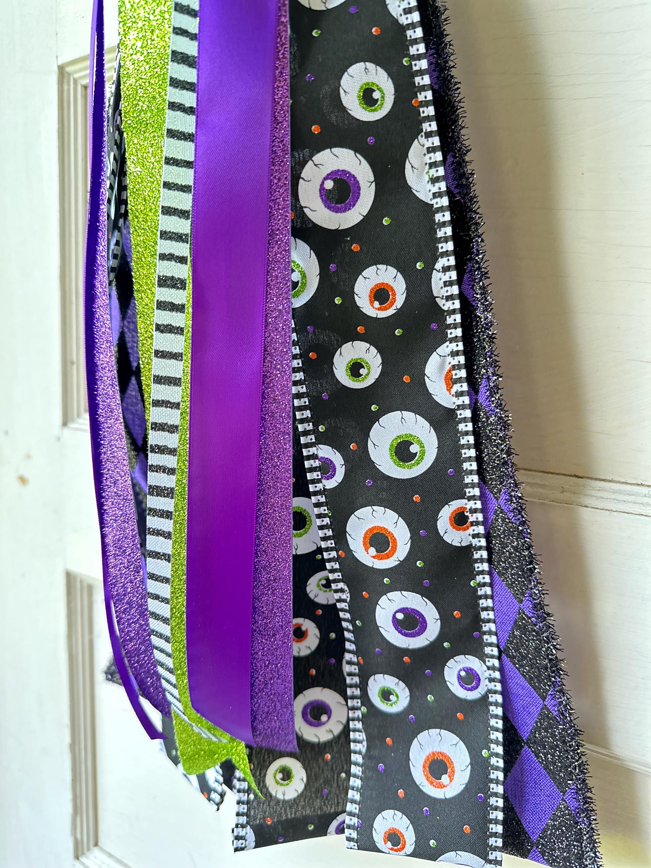 Gothic Style Door Bow Halloween Theme Display Spooky Entrance Accent Mixed Ribbon Collection Purple Black Lime Green Colors Eyeball Pattern Design Harlequin Style Detail Glitter Satin Texture Premium Quality Construction Seasonal Home