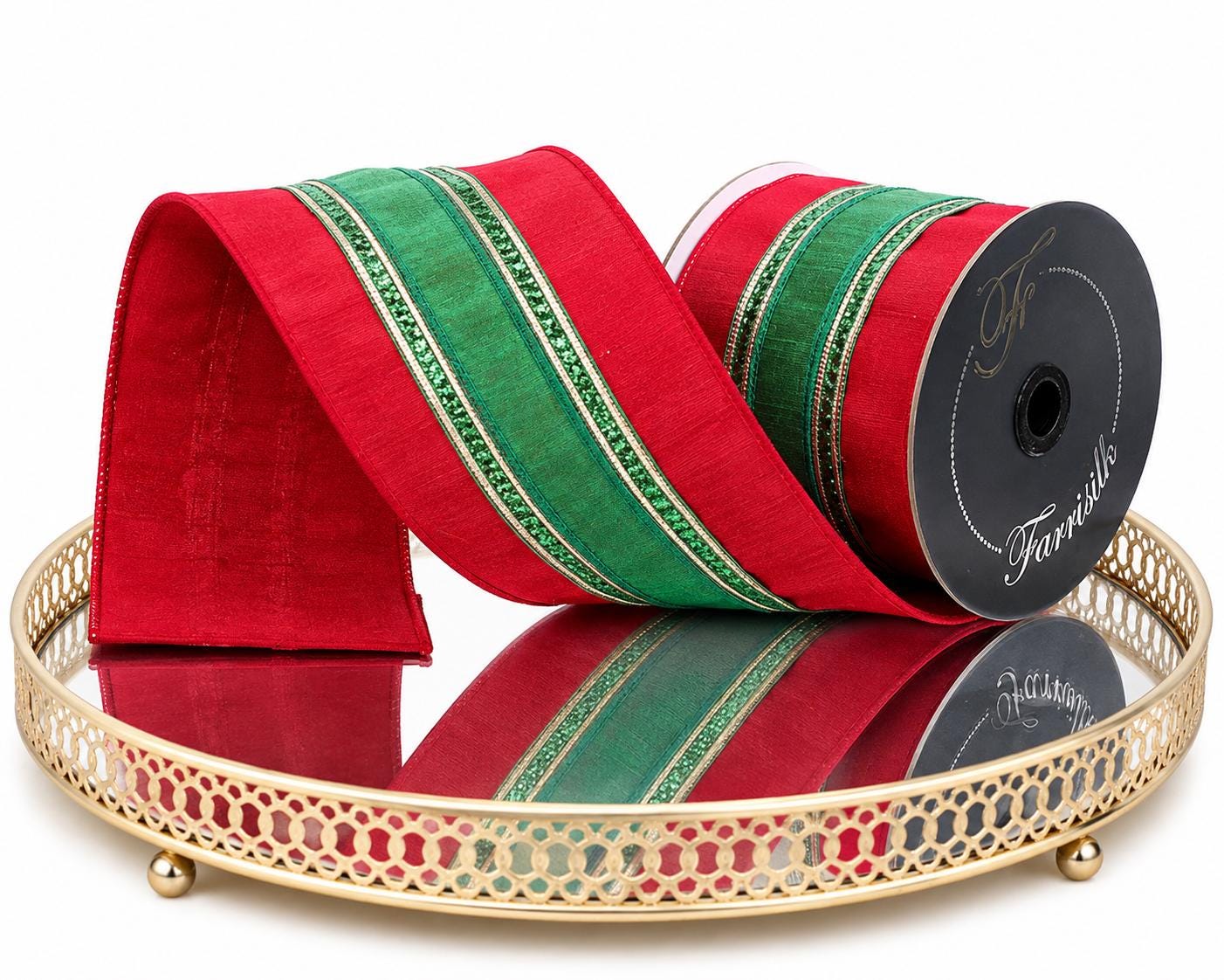 Red and green Farrisilk Christmas ribbon displayed on gold mirrored tray
